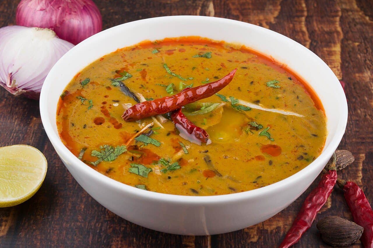 A bowl of dal tadka finished with fresh coriander